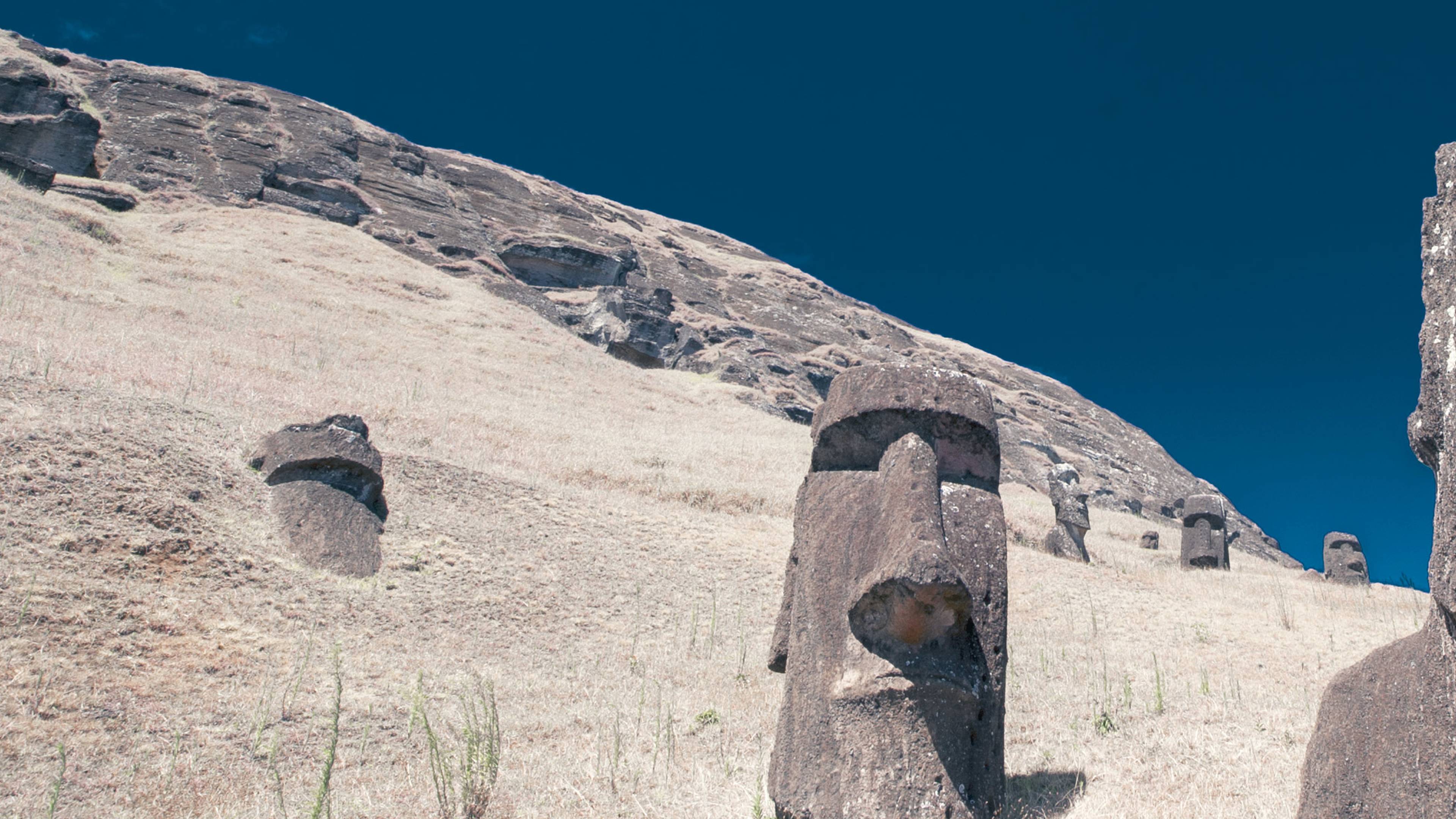 Moai heads on Easter Island, and island off Chile