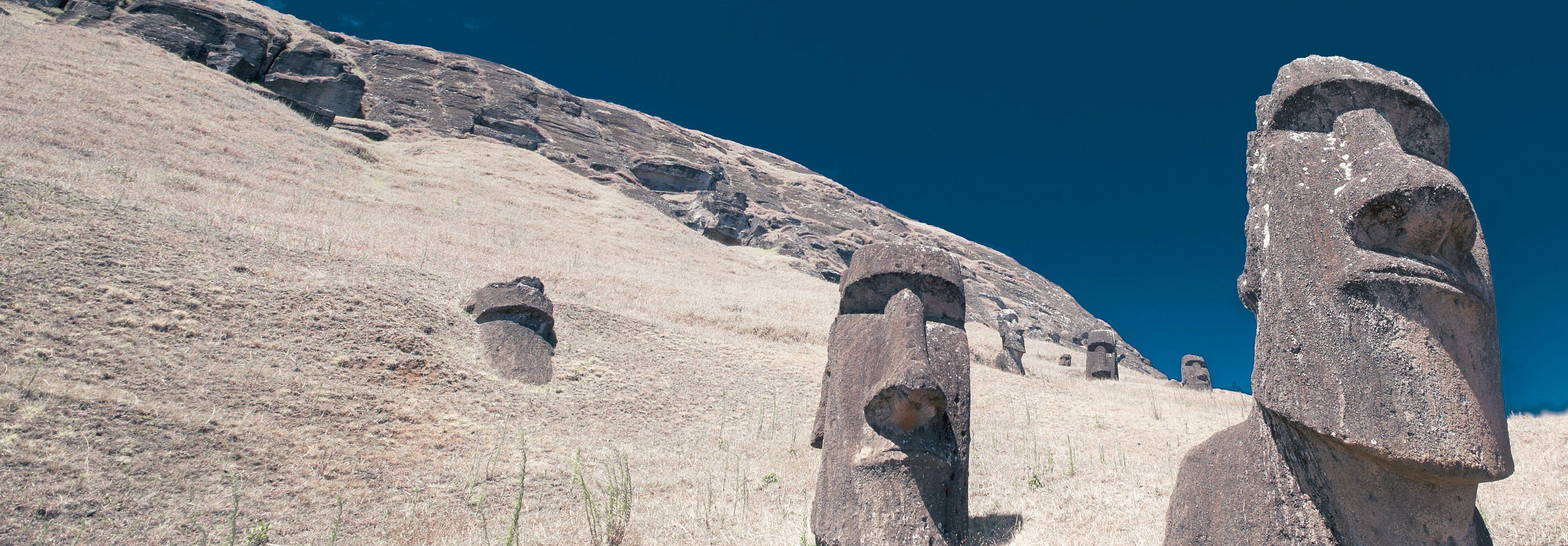 Moai heads on Easter Island, and island off Chile